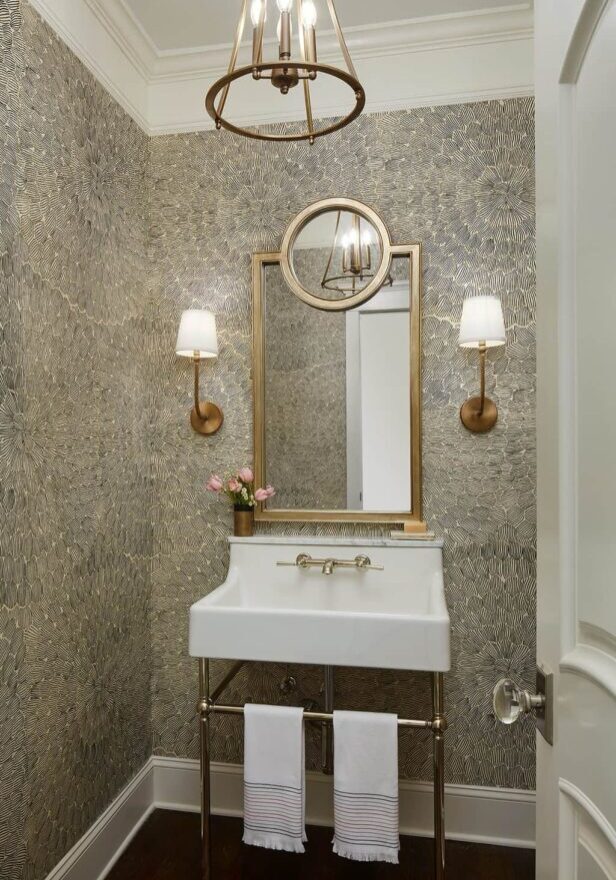 A bathroom with a sink and mirror in it